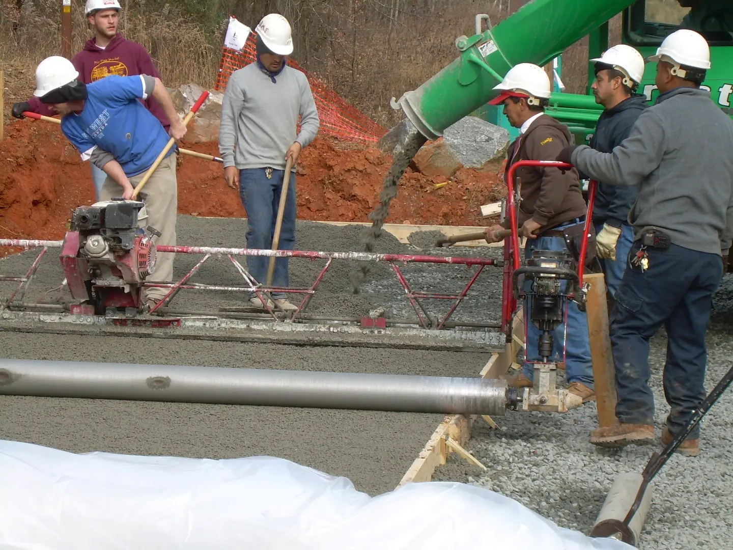 workers working on a paving system at the Goldbranch Creek parking lot